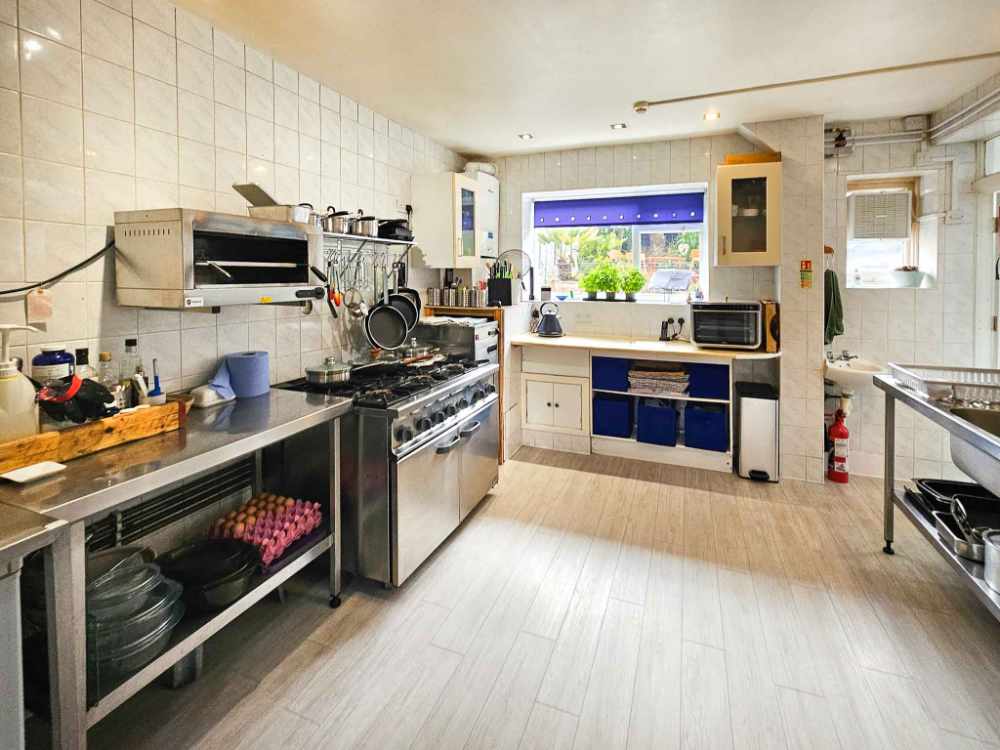 A Stunning Turn-Key Six-Bedroom Guest House with Exceptional Presentation and Strong Profitability